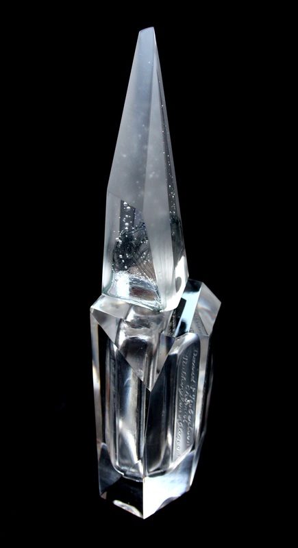 Aura — single faceted perfume bottle with engraved text