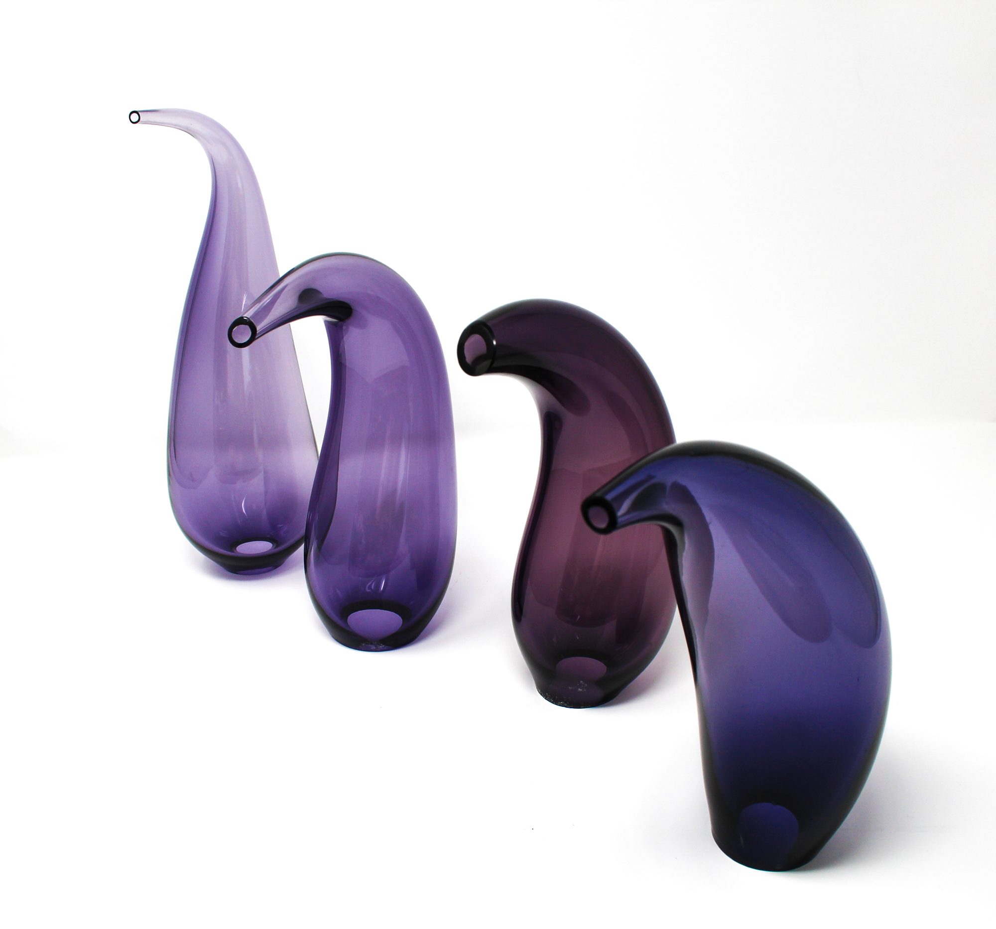 Fluidity — the group of blown glass forms arranged in a line