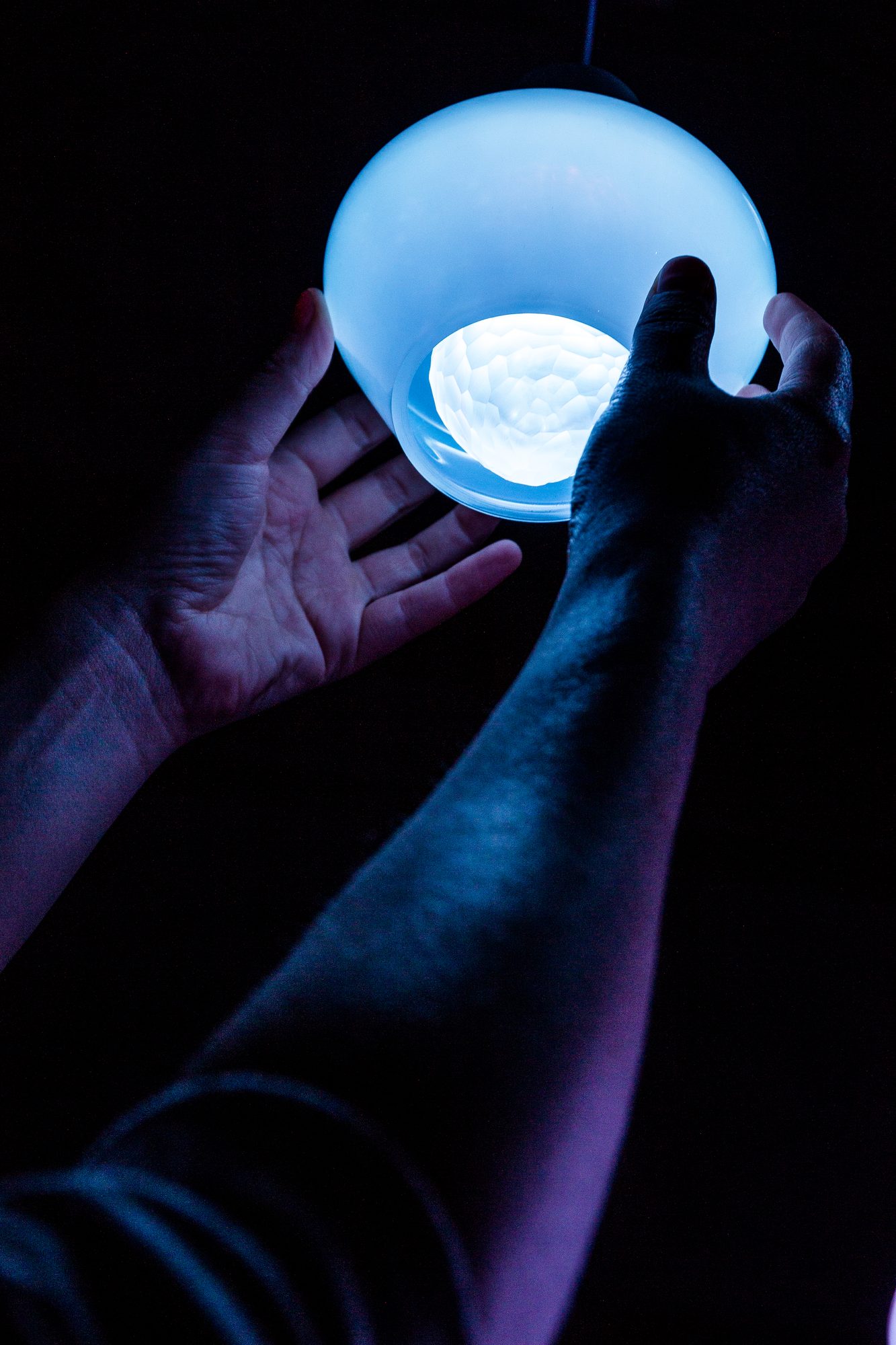 Jewel Lamp — pendant light held in two hands